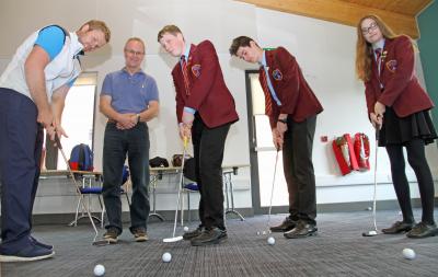 Golf professional Ben Rawsthorne left with mentor Steve Rawsthorne and NWHS students from left James Vann Kyran Turner and Millie Abbs