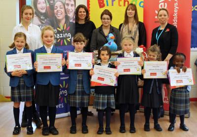 Hethersett Old Hall School pupils receive their certificates from Arnolds Keys