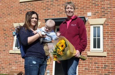 Holly Hann and baby Alfie receive the keys to their new home at Northrepps the 750th built by Victory Housing Trust from Christine Candlish of Victory