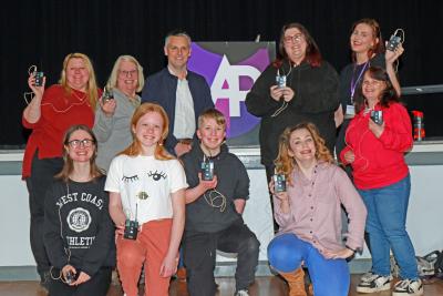 Jamie Norton of Lovewell Blake centre left and Vicky Aukett of Attleborough Players centre right with members of the Players