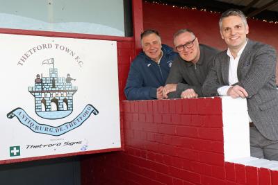 Jamie Norton of Lovewell Blake right with Thetford Town chairman Nigel Armes left and treasurer Darren Iles sm