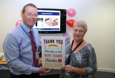 Jenny Hayman is congratulated on her 50 years service by Douglas Young
