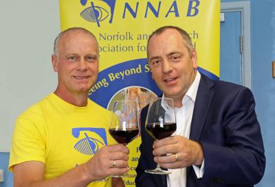 Jeremy Goss of the NNAB and wine expert Andy Newman toast the success of the charity wine tasting
