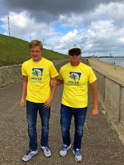 Jeremy Goss sets off on his blindfold walk from Gorleston guided by his son Jacob