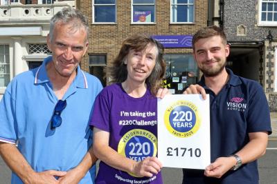 Joe Russell of Vision Norfolk right celebrates with vision impaired fundraiser Miranda Reeves and her husband Robert sm
