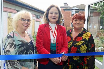 Lady Agnew cuts the ribbon to open the new sensory garden watched by Gina Dormer left and Amanda Skinner