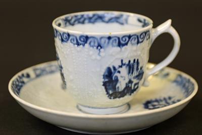 Lot 353 Lowestoft porcelain Hughes moulded cup and saucer estimate 300 400