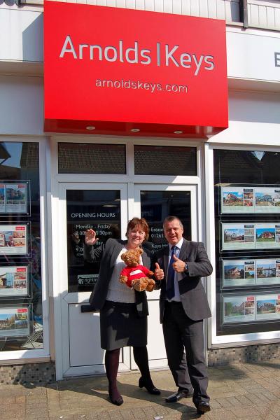 Louise Hillman and Allan Saunders outside Arnolds Keys Sheringham office