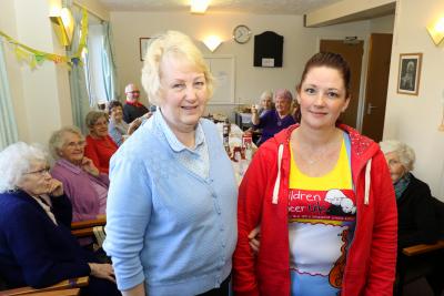 Marathon runner Marie Charles right with her mum Kathy Glanville at the fundraising coffee morning at Eleanor Road sm