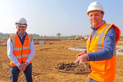 Mark Burghall of Flagship right cuts the first sod at Martham watched by Paul Pitcher of Wellington sm