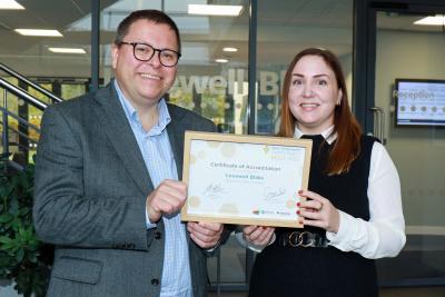 Mark Proctor and Claire Moore of Lovewell Blake with the firms Gold Best Employer award sm