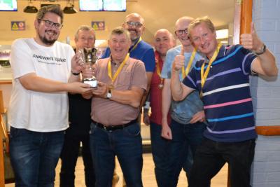 Matthew Waters of Lovewell Blake left presents the trophy to winning team GS Computers