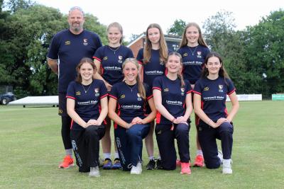 Members of the Norfolk U18s girls cricket team with coach Pete Free sm