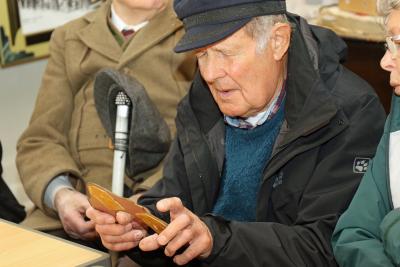 Mike Blyth gets hands on with a shoe cutting template at Norwichs Bridewell Museum 1