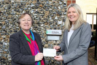 NDAEA chair Jan Hytch left presents a cheque to Jo Gillies Wheatley of St Martins Housing Trust sm