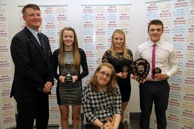 NWHS students Lauren Hemp with cup Chloe Yarham and Liam Clarke with head of PE Paul Bradshaw and guest speaker Fran Williamson