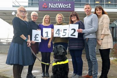 NatWest staff celebrate their fundraising effort for the NNAB sm