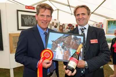Norfolk Show Art Exhibition head steward Tom Cringle left and Guy Gowing from Arnolds Keys with the winning picture sm