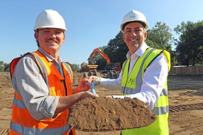 Paul Legrice right and Luke Matthews of Abel Homes cut the first sod at the site of 17 new homes in East Harling sm