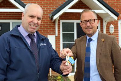 Paul PItcher right of Wellington hands over the keys to the Reydon homes to Ian Fieldhouse of Orbit sm