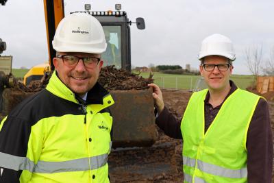 Paul Pitcher of Wellington left and John Archibald of Victory Housing Trust mark the start of work on 24 new affordable homes in B