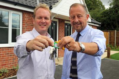 Paul Pitcher of Wellington right hands the keys over to Scott Bailey of Havebury Housing Partnership sm