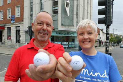 Phil Cooper of Arnolds Keys and Sarah of Norwich Mind celebrate the success of the Arnolds Keys Golf Day