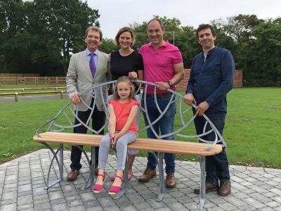 Phil and Bonnie Royle and their daughter Grace unveil the new bench watched by Tony Abel left and James Spedding right sm