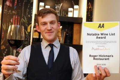 Roger Hickmans Restaurant front of house manager Ed Akister with the AA wine award sm
