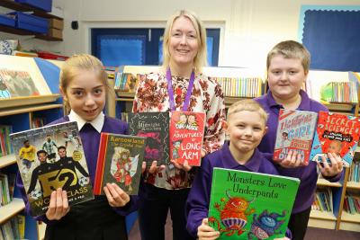 Swaffham Primary Academy head teacher Nicola Kaye with pupils from left Madison Alfie and Logan sm