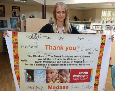 Teresa Gascoyne with the banner from the Ghana Street Academy