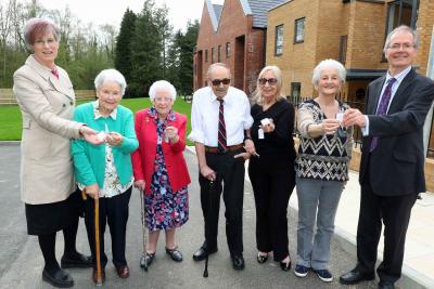 The first residents at Leander Court in Norwich receive their keys from Norwich Housing Society sm