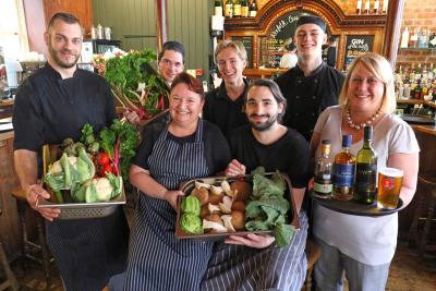 The team at The Last Wine Bar showing off armfuls of Norfolk produce sm