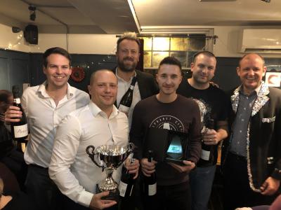 The victorious team from Barclays receives the trophy from Mark Mayhew of Arnolds Keys right