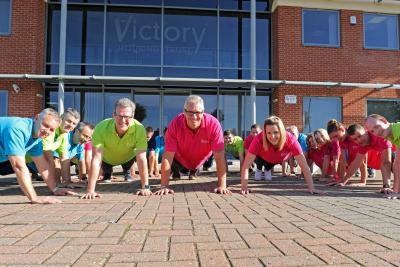 Victory Housing Staff doing the 22 Push Up Challenge