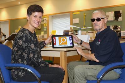 Vision Norfolk volunteer co ordinator Emily Orford and volunteer David Page sm