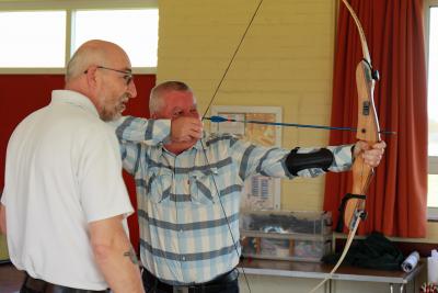 Vision impaired archer Jason Beasley is guided by Archery GB coach Andy Beer sm