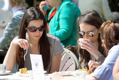 Visitors to Stody Lodge gardens enjoying afternoon tea provided by the Norfolk Norwich Association for the Blind