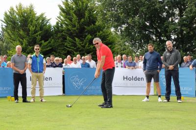 Visually impaired golfer Robin Sizeland tees off to start the NNAB golf day