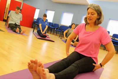 Visually impaired yoga teacher Angelique Weatherby leads a class at the NNAB sm