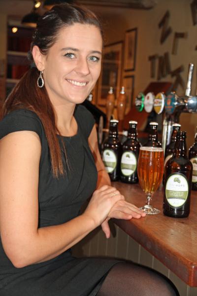 White Hart Hingham manager Marta Sztorc with a bottle of The Hops Bitter